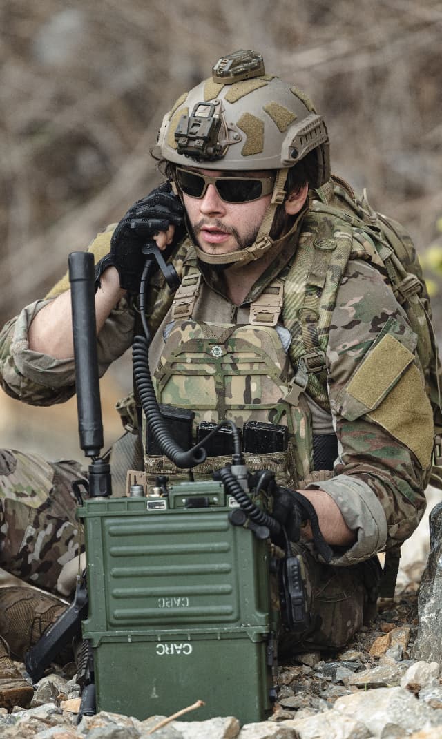 soldier operating tactical radio